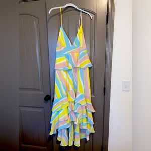 Maxi dress, shorter in the front, longer in the back. NWT